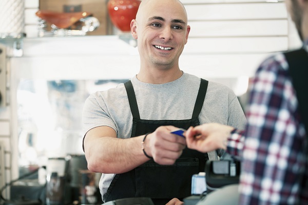 Bike shop owner receiving payment.